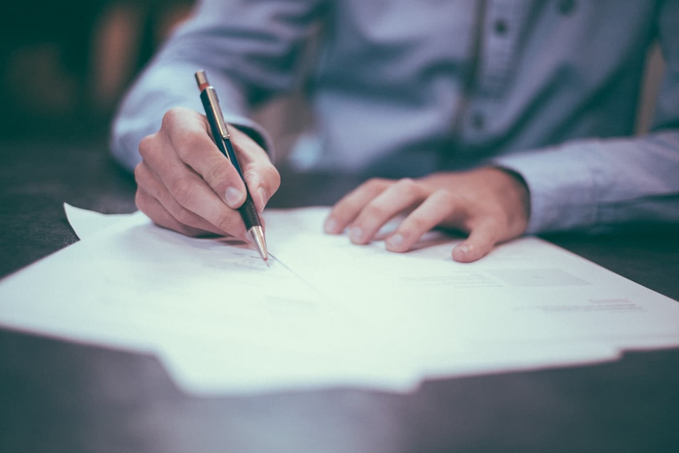 Business professionals reviewing ISO certification documents